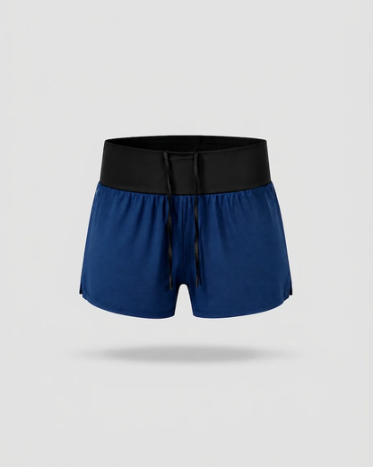 Pantaloneta de running SKUR 5AM 2 en 1 en azul noche sobre fondo liso